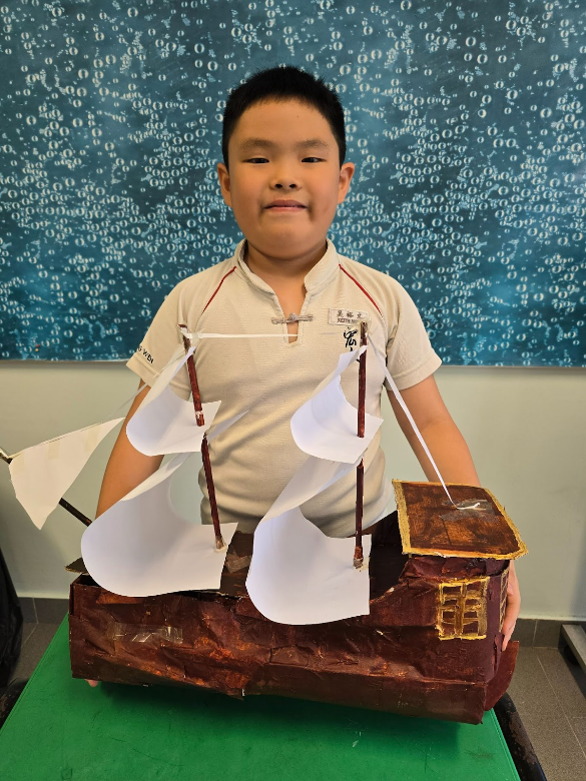 boy with a model ship
